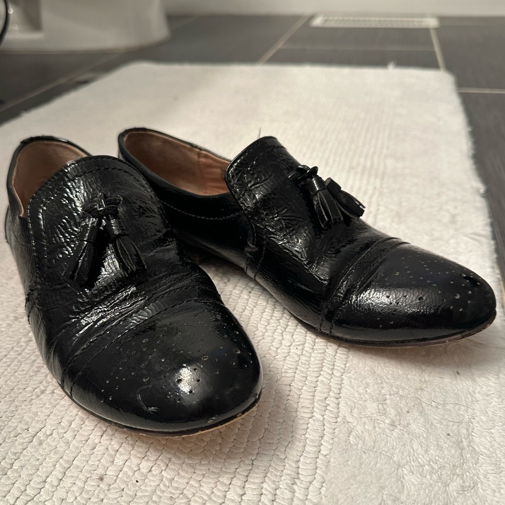 Steve Madden Glossy Black Tassel Loafers